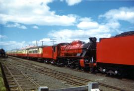 Steam train with passenger carriages